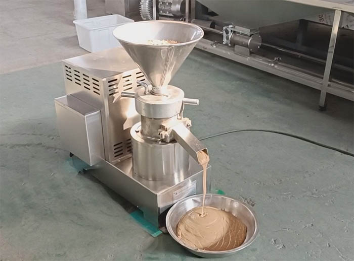 Peanut butter machine grinding peanuts